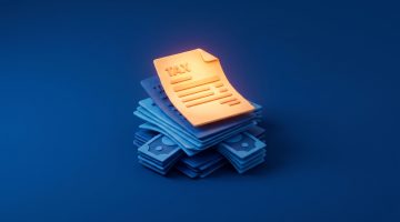 documentos fiscais empilhados representando a alíquota IBS e CBS na transição tributária brasileira